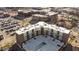 Aerial of a modern apartment community featuring a large parking area and surrounding neighborhood at 1155 S Rangeline Rd # 507, Carmel, IN 46032