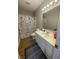 Well-maintained bathroom featuring vanity with sink, toilet, and shower with decorative curtain at 6951 Governors Point Blvd, Indianapolis, IN 46217