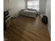 Well-lit bedroom featuring hardwood floors and a neutral color scheme at 6951 Governors Point Blvd, Indianapolis, IN 46217