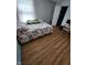 Cozy bedroom with hardwood floors, large window, and ample closet space at 6951 Governors Point Blvd, Indianapolis, IN 46217