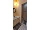Bathroom featuring linoleum flooring, a toilet, and a sink with decorative mirror at 3230 Meadowcrest Dr, Anderson, IN 46011