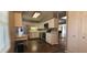 Modern kitchen with stainless steel appliances, white cabinets and eat-in dining area at 3230 Meadowcrest Dr, Anderson, IN 46011