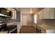 Bright kitchen featuring stainless steel appliances, light countertops, and a dining nook at 3230 Meadowcrest Dr, Anderson, IN 46011