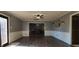 Open living room with hardwood floors, neutral paint, and natural light in an open space at 3230 Meadowcrest Dr, Anderson, IN 46011