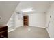 Unfinished basement room with bookshelves at 1185 N 10Th St, Noblesville, IN 46060