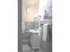 Classic bathroom features a white vanity, decorative mirror, and blue accent painting at 1185 N 10Th St, Noblesville, IN 46060