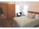 Well-lit bedroom featuring hardwood floors, a cozy bed, and closet space for optimal comfort at 1185 N 10Th St, Noblesville, IN 46060