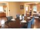 Charming dining room with hardwood floors and seating for four, conveniently located near the kitchen at 1185 N 10Th St, Noblesville, IN 46060