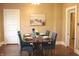Warm dining room setting features hardwood floors, neutral walls, and easy access to adjacent rooms at 1185 N 10Th St, Noblesville, IN 46060
