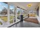 Screened porch with swing and view of the yard at 1185 N 10Th St, Noblesville, IN 46060