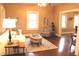 Cozy living room boasts hardwood floors, neutral walls, and ample natural light from multiple windows at 1185 N 10Th St, Noblesville, IN 46060