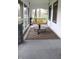 Relaxing screened-in porch featuring a comfortable swing, round coffee table, and patterned area rug at 1185 N 10Th St, Noblesville, IN 46060