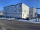 New construction modern townhome with multiple units and covered front porches at 249 N Temple Ave, Indianapolis, IN 46201