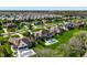 A beautiful aerial view of a luxury home and an inground swimming pool surrounded by a lush green lawn at 11492 Hanbury Manor Blvd, Noblesville, IN 46060