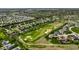 Expansive aerial view showcasing the residential community, golf course and mature trees at 11492 Hanbury Manor Blvd, Noblesville, IN 46060