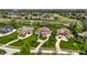 Panoramic aerial view showcasing upscale homes nestled among lush greenery and a golf course at 11492 Hanbury Manor Blvd, Noblesville, IN 46060