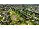 An aerial view of a golf course community with beautiful homes, winding streets and lush greenery at 11492 Hanbury Manor Blvd, Noblesville, IN 46060