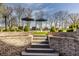 Backyard with stairs, umbrellas and lounge chairs at 11492 Hanbury Manor Blvd, Noblesville, IN 46060