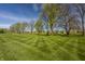 A wide view of the backyard and lawn in front of the home at 11492 Hanbury Manor Blvd, Noblesville, IN 46060