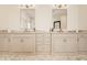 Bright bathroom features double vanities with marble countertops and bronze fixtures at 11492 Hanbury Manor Blvd, Noblesville, IN 46060
