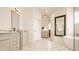 Elegant bathroom features double vanities, soaking tub, glass enclosed shower, and mosaic tile flooring at 11492 Hanbury Manor Blvd, Noblesville, IN 46060