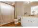 Bathroom with a white vanity, granite countertop, mirror, and a shower with a curtain at 11492 Hanbury Manor Blvd, Noblesville, IN 46060