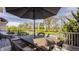 Outdoor deck featuring an umbrella-covered table with wicker chairs, perfect for outdoor entertaining at 11492 Hanbury Manor Blvd, Noblesville, IN 46060