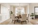 Bright dining room with chandelier, wood table and neutral decor at 11492 Hanbury Manor Blvd, Noblesville, IN 46060