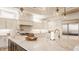 Bright kitchen features custom cabinets, marble countertops, and a large center island at 11492 Hanbury Manor Blvd, Noblesville, IN 46060