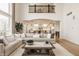 Bright and spacious living room featuring hardwood floors and comfortable seating at 11492 Hanbury Manor Blvd, Noblesville, IN 46060