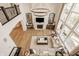 Spacious living room with hardwood floors, fireplace, and large windows for ample light at 11492 Hanbury Manor Blvd, Noblesville, IN 46060