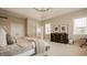 Spacious main bedroom features tray ceilings, a seating area, and soft, neutral colors at 11492 Hanbury Manor Blvd, Noblesville, IN 46060
