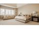 Bright and inviting main bedroom with neutral decor, plush seating, and stylish lamps at 11492 Hanbury Manor Blvd, Noblesville, IN 46060