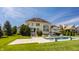 Back exterior view featuring a stunning pool and elegant lounge furniture with the home in the background at 11492 Hanbury Manor Blvd, Noblesville, IN 46060