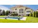 Back exterior view featuring a stunning pool and elegant lounge furniture with the home in the background at 11492 Hanbury Manor Blvd, Noblesville, IN 46060