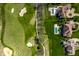 Aerial view showcasing a collection of swimming pools in a golf course community at 11492 Hanbury Manor Blvd, Noblesville, IN 46060