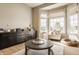 Comfortable sitting area with large windows, hardwood floors, and relaxed decor at 11492 Hanbury Manor Blvd, Noblesville, IN 46060