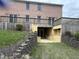 A walk-out basement patio with steps leading up to a raised deck at 4739 Beechwood Rd, Avon, IN 46123