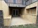 Newly-constructed wooden patio with built-in seating area, located off the basement walkout at 4739 Beechwood Rd, Avon, IN 46123