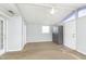 Bedroom featuring a carpeted floor, a ceiling fan, and doors to the outside at 2819 Mars Hill St, Indianapolis, IN 46241