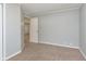 Bedroom with gray walls, carpeted floors, and a view to another room at 2819 Mars Hill St, Indianapolis, IN 46241