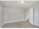 Bedroom with a carpeted floor and gray walls with a view to another room at 2819 Mars Hill St, Indianapolis, IN 46241