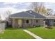 Inviting brick home with a lush lawn and easy access with a concrete sidewalk at 2819 Mars Hill St, Indianapolis, IN 46241