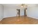 Living room showcasing open access to other rooms, neutral paint, and laminate flooring at 2819 Mars Hill St, Indianapolis, IN 46241