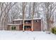 Back of house features two-story brown exterior, deck, and sliding glass doors at 10555 E 400 S, Zionsville, IN 46077