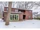 Two-story home exterior with wood siding and snowy yard at 10555 E 400 S, Zionsville, IN 46077