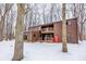 Two-story home exterior with wood siding and snowy yard at 10555 E 400 S, Zionsville, IN 46077