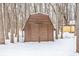 Wooden storage shed in a snowy backyard setting at 10555 E 400 S, Zionsville, IN 46077