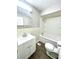 Clean bathroom with white vanity, tub, and tile flooring at 2709 E Troy Ave, Indianapolis, IN 46203