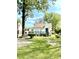 House with large tree and grassy yard at 2709 E Troy Ave, Indianapolis, IN 46203